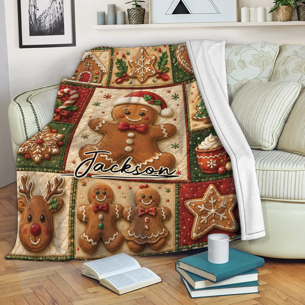 Christmas gingerbread throw blanket draped over a sofa with cookie, candy cane, and holiday tree artwork