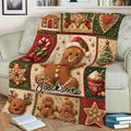 Festive Christmas gingerbread blanket styled on a couch with cookies, reindeer, snowflakes, and candy cane details