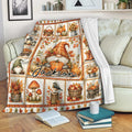 Autumn gnome throw blanket draped over a sofa with pumpkins, sunflowers and harvest accents