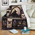Witchcraft blanket draped over a sofa with mystical witch, crystal, candle, raven, and black cat artwork