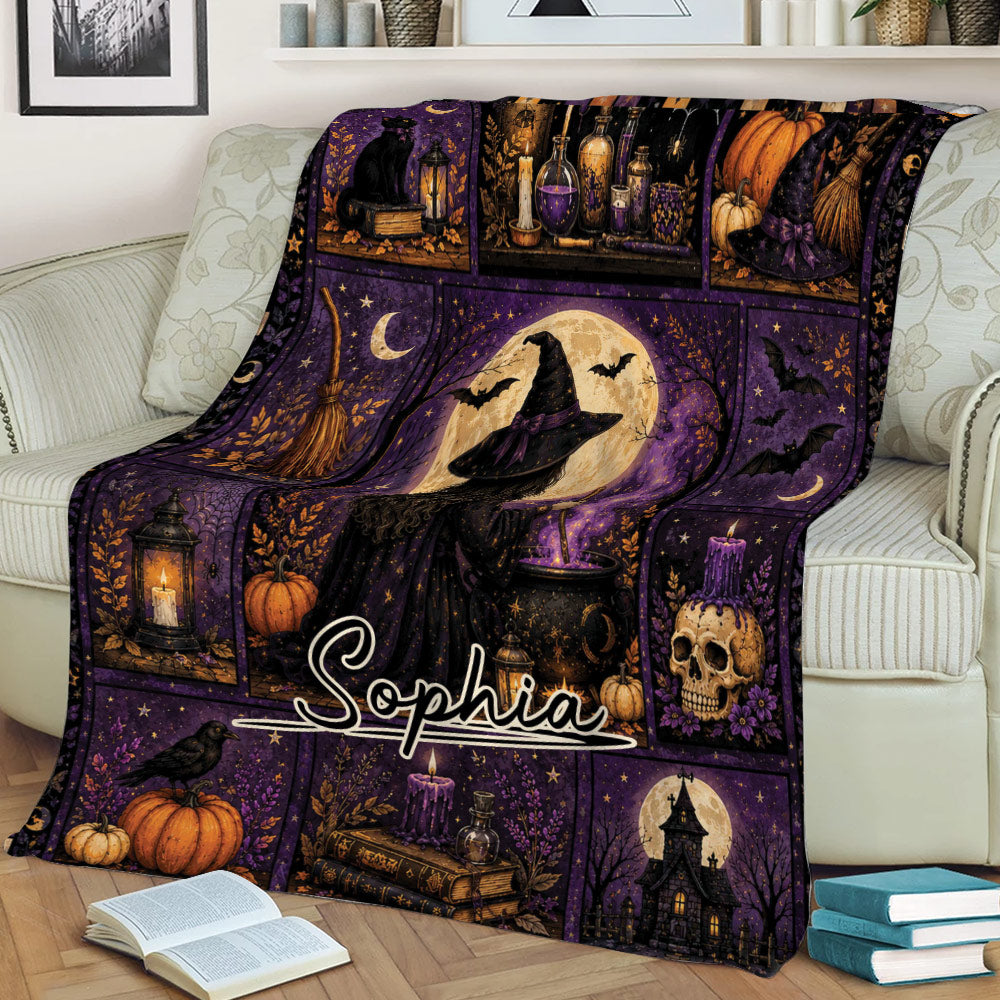 Purple witchcraft blanket displayed on a couch with a witch, moon, cauldron, broom, black cat, bats, and gothic decor