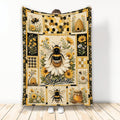 Bee throw blanket with honeycomb patterns, sunflowers, daisies, beehives, and honey-themed artwork