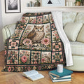 Floral owl throw blanket styled over a sofa with a cozy reading nook and botanical decor
