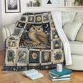 Owl throw blanket displayed on a sofa with ornate floral panels, moonlit artwork, and woodland details