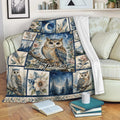 Owl throw blanket draped over a sofa with floral, moonlit, and woodland artwork