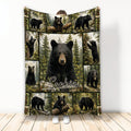 Bear throw blanket featuring a central black bear and surrounding forest wildlife panels