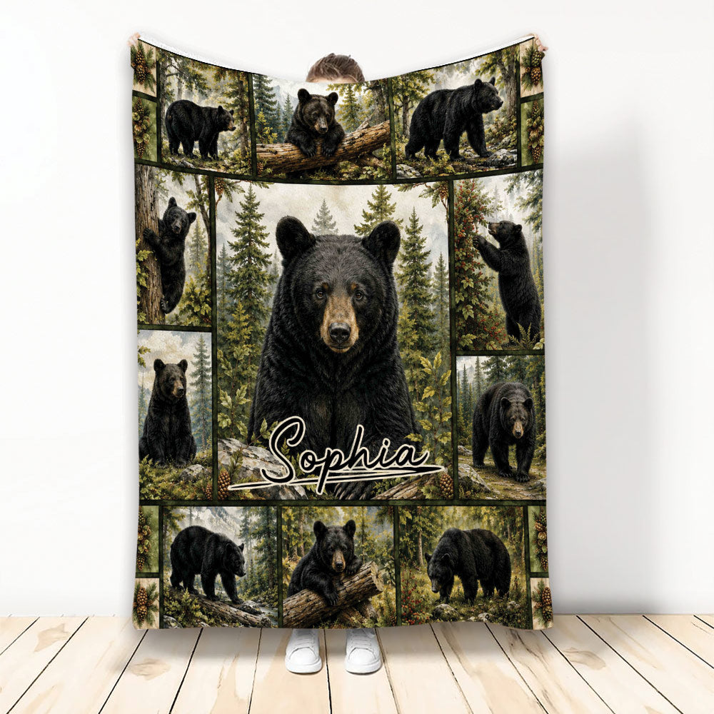 Bear throw blanket featuring a central black bear and surrounding forest wildlife panels