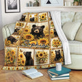 Bear and sunflower throw blanket displayed on a living room sofa with books nearby