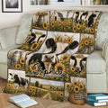 Cow blanket displayed on a sofa with rustic sunflower fields, farmhouse scenes, and cattle artwork