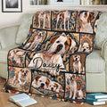 American Bulldog blanket spread across a sofa, featuring a large bulldog portrait surrounded by ornate patterned panels