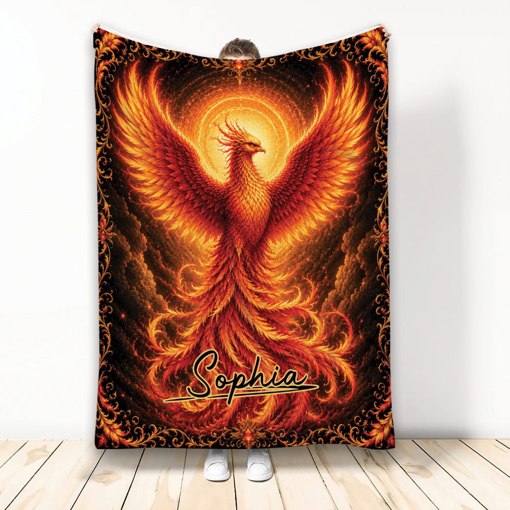 Fiery phoenix throw blanket with glowing wings, ornate black border, and vivid red and gold artwork