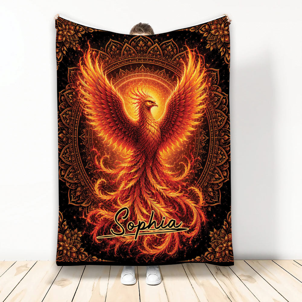 Fiery phoenix blanket displayed upright with glowing orange wings and ornate black mandala artwork