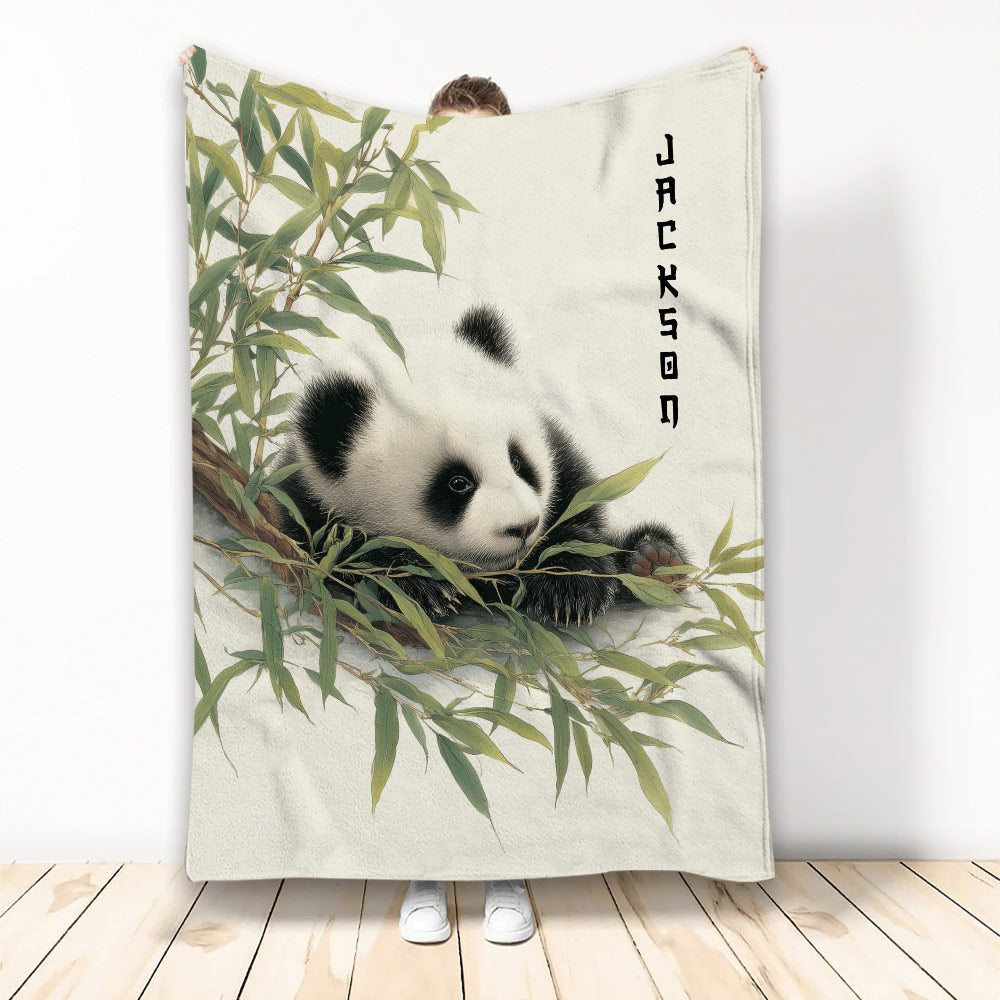 Panda throw blanket featuring a resting panda among bamboo leaves in a standing room display