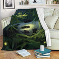 Panda throw blanket draped over a sofa, showing dark green bamboo forest artwork