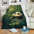 Panda blanket draped over a sofa with colorful bamboo artwork for cozy lounging