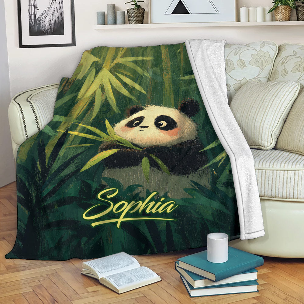 Panda blanket draped over a sofa with colorful bamboo artwork for cozy lounging
