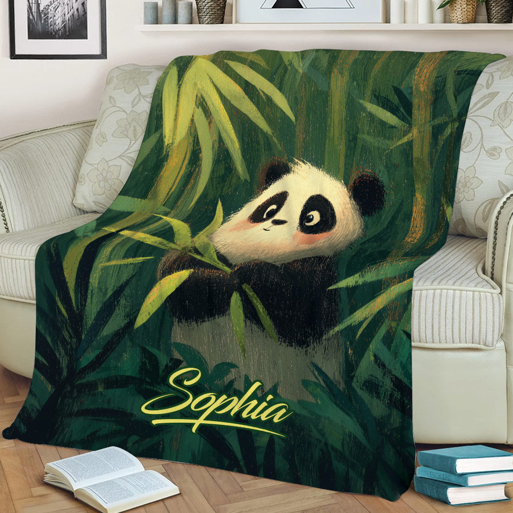 Close lifestyle view of a panda throw blanket with woodland bamboo scenery on a couch