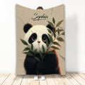 Panda throw blanket featuring a detailed black and white panda surrounded by green bamboo leaves