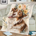 Close view of a floral Brittany Spaniel throw blanket styled on a sofa