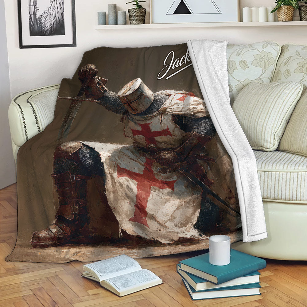 Knights Templar throw blanket displayed on a sofa with dramatic medieval knight artwork