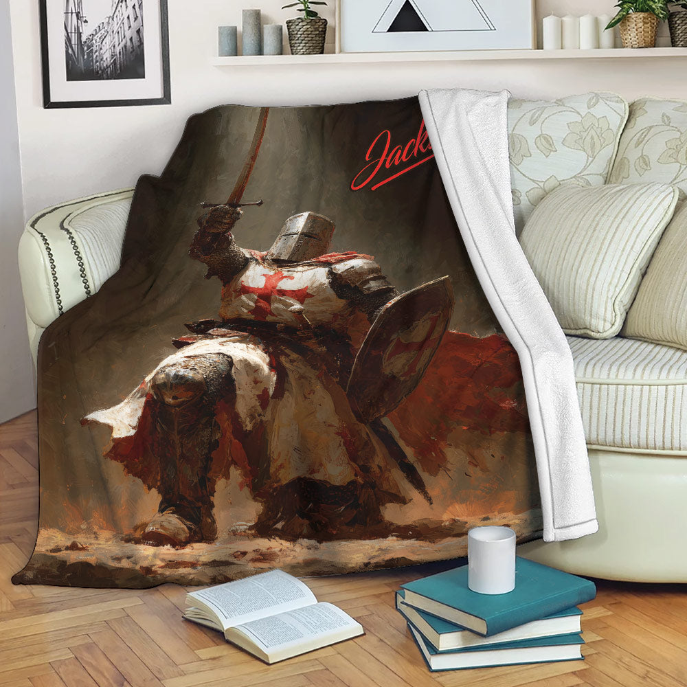 Knights Templar blanket displayed on a sofa with dramatic medieval knight and red cross artwork