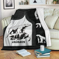Polar bear throw blanket draped over a sofa, featuring black and white wildlife artwork
