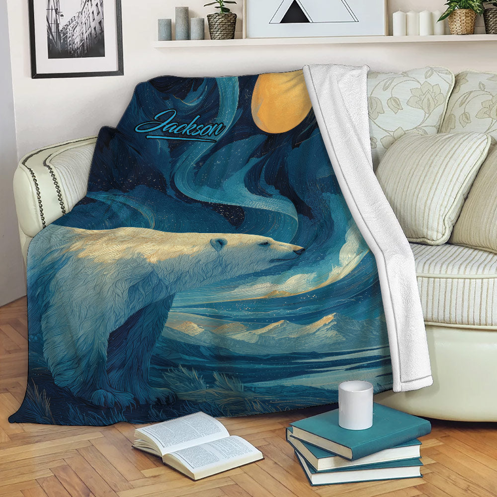 Polar bear blanket draped over a sofa with Arctic scenery, moonlit waves, mountains, books, and a coffee mug