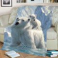 Arctic polar bear family throw blanket draped across a sofa with mountain scenery