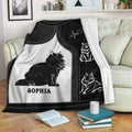 Maine Coon cat throw blanket displayed on a sofa with black and white artwork