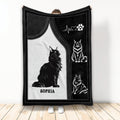 Black and white Maine Coon cat blanket design shown held up in a bright room