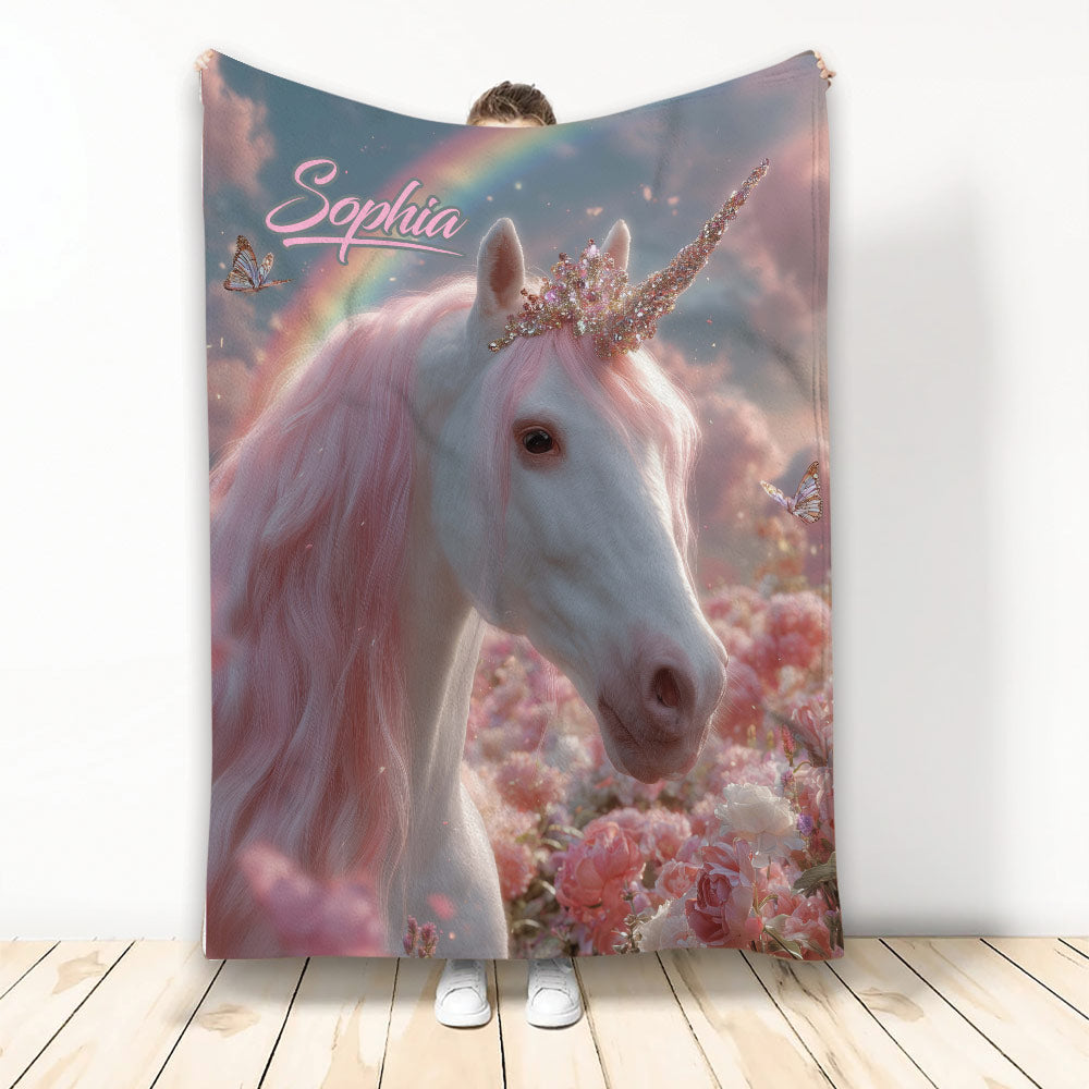 Unicorn throw blanket featuring a white unicorn with pink mane, jeweled horn, rainbow, butterflies, and flowers
