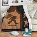 Bigfoot throw blanket with patriotic artwork draped over a living room sofa