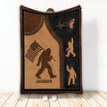 Bigfoot throw blanket with patriotic flag artwork, rustic brown and black design, displayed upright