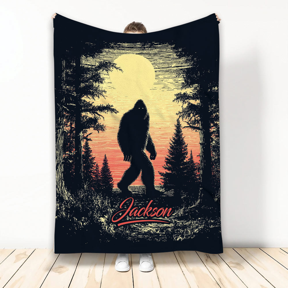 Bigfoot throw blanket featuring a Sasquatch silhouette in a moonlit forest at sunset