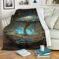 Mushroom blanket displayed on a sofa with fantasy woodland artwork and glowing blue crystals