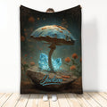 Mushroom throw blanket with a giant blue-capped mushroom, glowing crystals, and woodland flowers