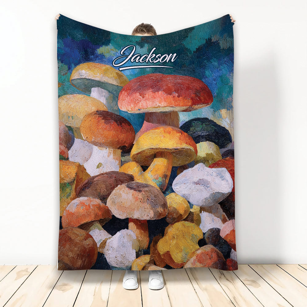 Colorful mushroom throw blanket displayed upright with painterly forest fungi artwork