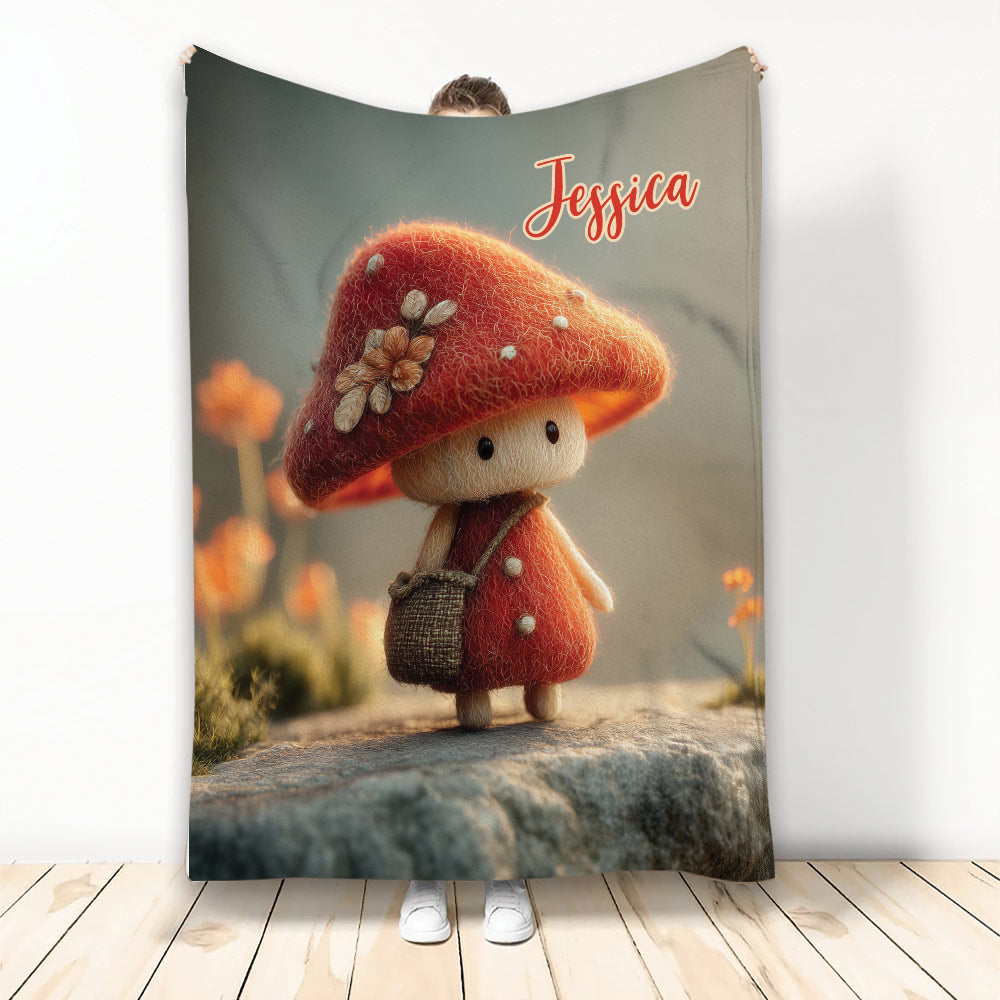 Whimsical red mushroom character blanket displayed as a full-length cozy throw