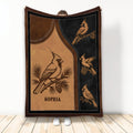 Cardinal throw blanket displayed vertically with vintage bird illustrations in brown, tan, and black