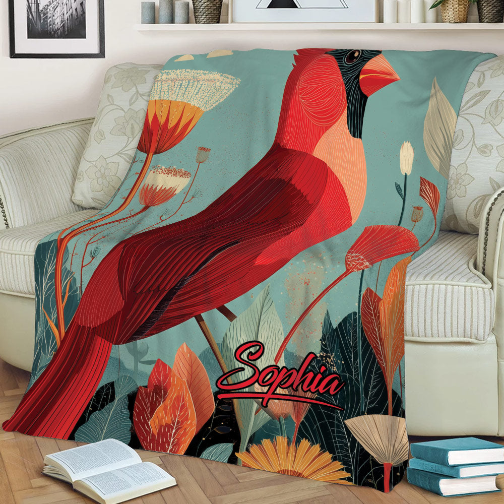 Close lifestyle view of a red cardinal throw blanket with detailed feathers and autumn-inspired foliage