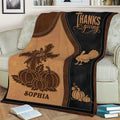 Close view of Thanksgiving blanket featuring pumpkins, turkey, cross artwork, and warm fall colors