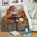 Thanksgiving turkey blanket draped over a sofa with warm autumn colors and cozy reading decor