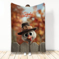 Thanksgiving throw blanket featuring a whimsical turkey in a pilgrim hat behind a rustic wooden fence