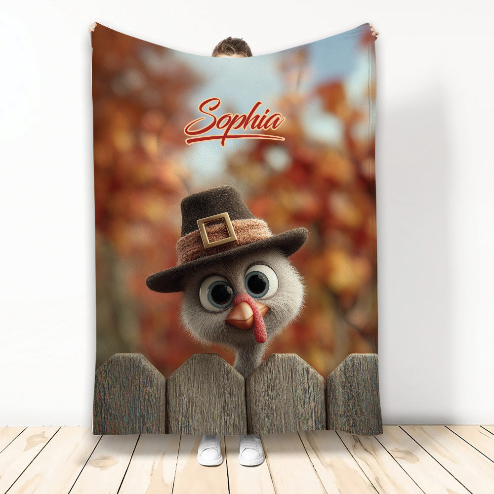 Thanksgiving throw blanket featuring a whimsical turkey in a pilgrim hat behind a rustic wooden fence