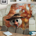 Close view of a Thanksgiving turkey throw blanket with autumn foliage and rustic harvest artwork