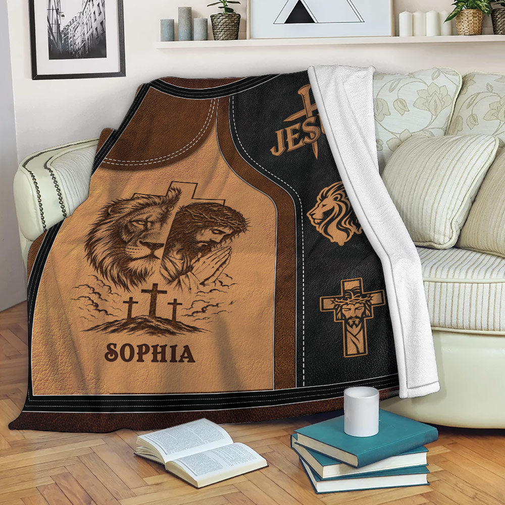 Christian blanket displayed on a sofa with Jesus, cross, lion, and prayer-themed artwork