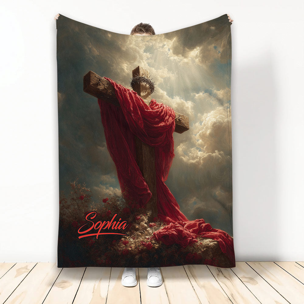 Christian throw blanket featuring Jesus on the cross beneath radiant clouds and dramatic red drapery