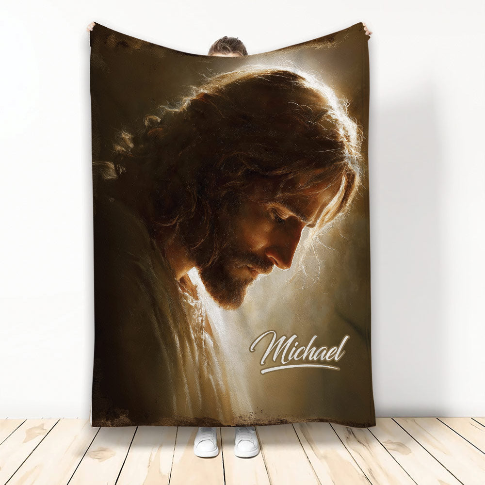 Christian blanket displaying a warm-toned depiction of Jesus surrounded by radiant light