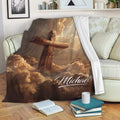 Christian cross blanket draped over a sofa with warm cloud and sunlight artwork