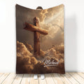 Christian cross throw blanket featuring a wooden cross rising through dramatic golden clouds